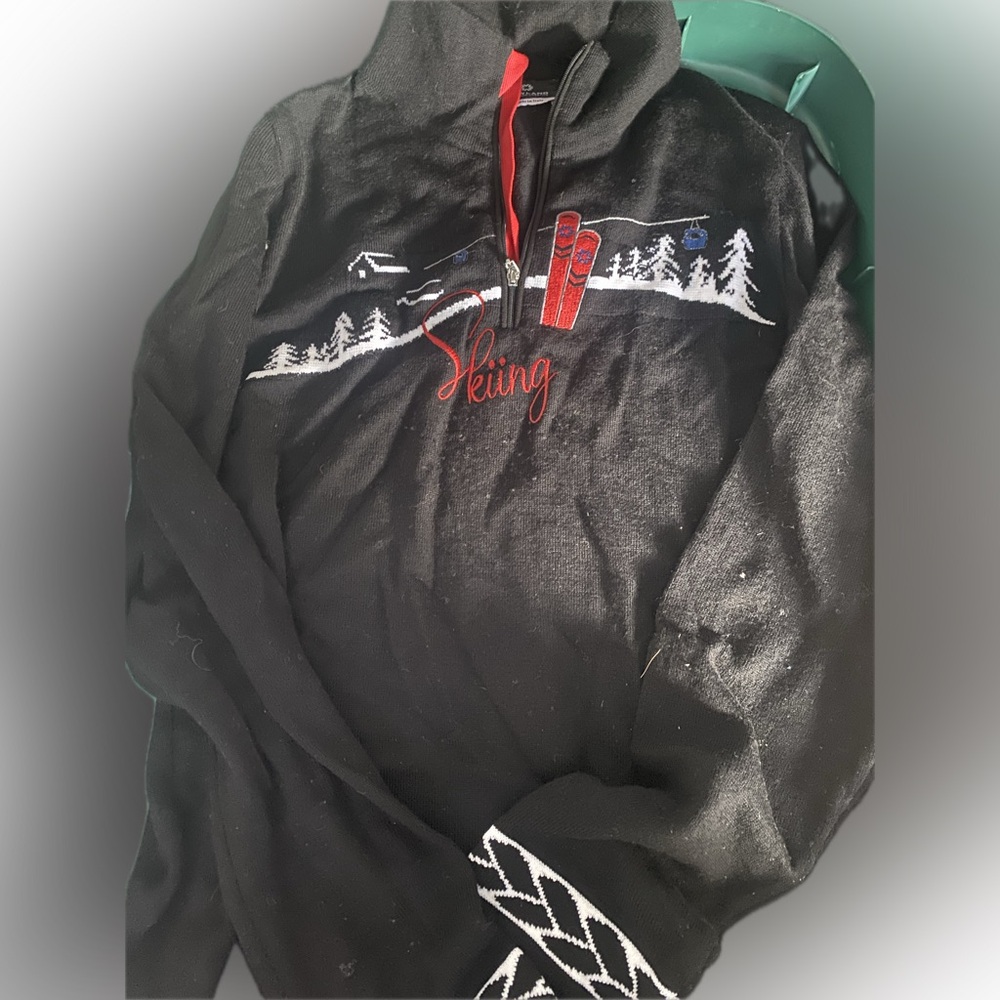 Cozy Black Turtleneck Sweater with Red Skiing Design